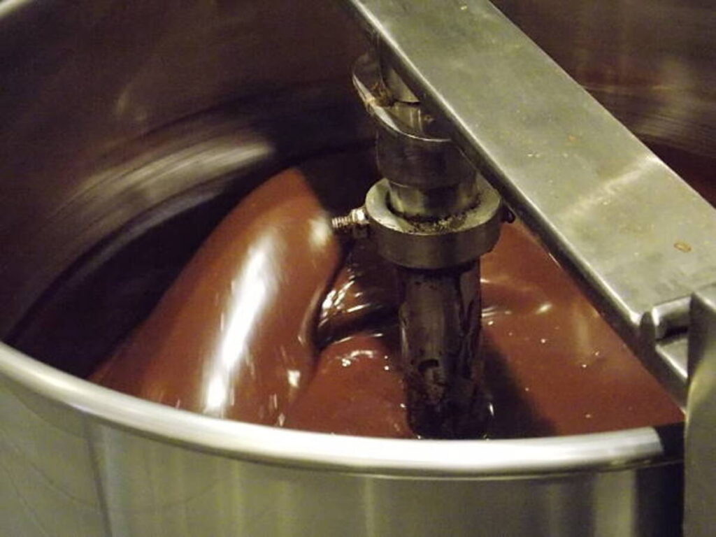 https://media.istockphoto.com/id/538777834/photo/liquid-chocolate-churning-in-machine.jpg?s=612x612&w=0&k=20&c=ItgjsHG2SwlStjYgUYdgABIdQPPqeC_EJ78JaUfAJG0=